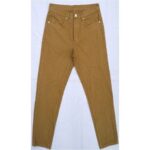 A pair of mustard-colored slim-fit jeans laid flat.